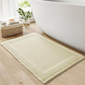 RESARE Waffle Bath Mat for Bathroom, Super Absorbent Bathroom Rugs Non Slip Machine Washable, Ultra Soft Quick Dry Boho Bath Rugs with Tassels for Floor, Upgraded Bordered Design, 17"x24" Cream